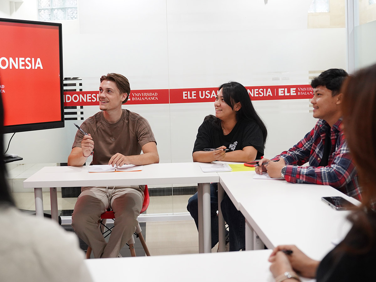 Adult learners practising Spanish communication in a small group