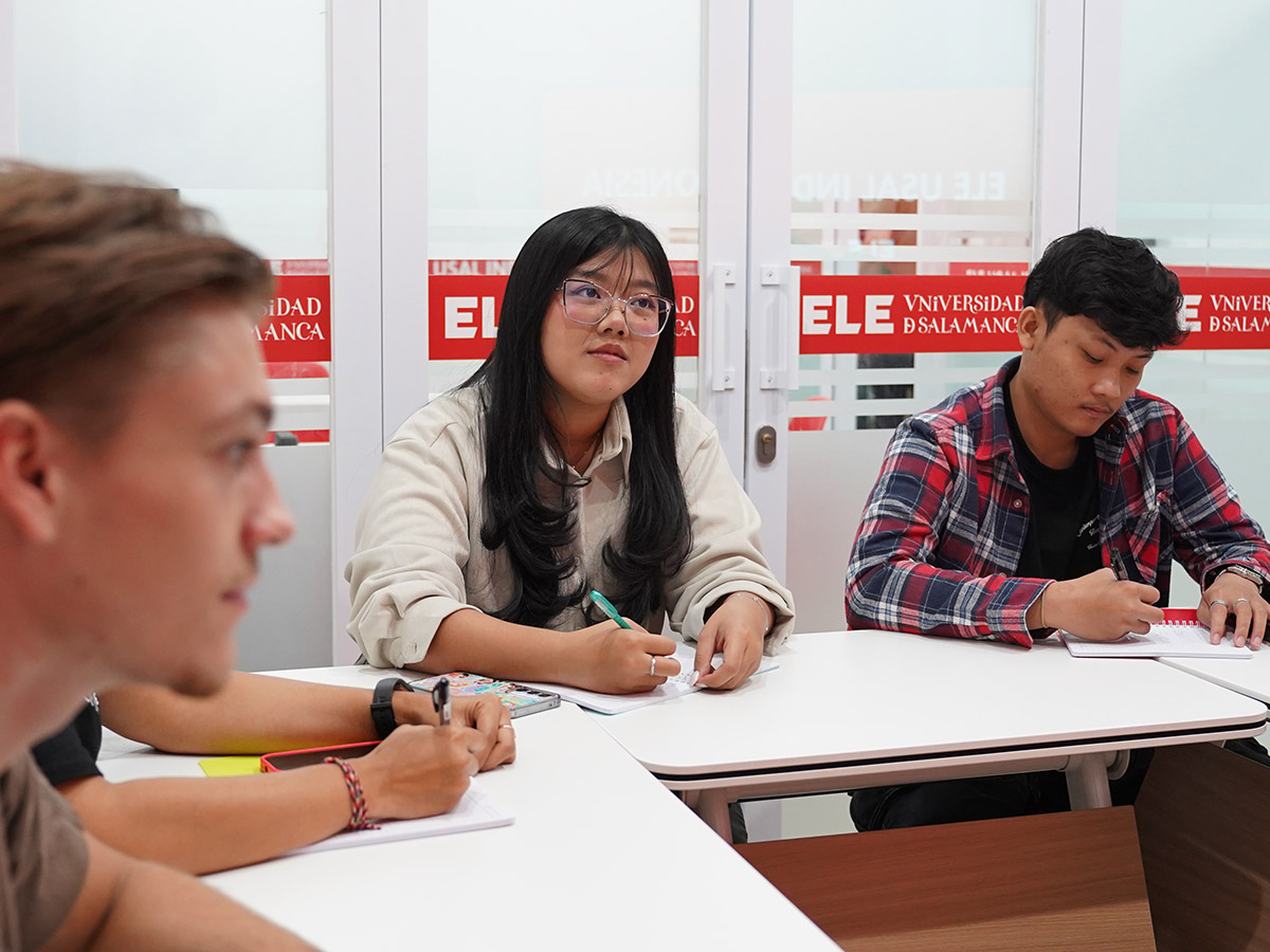 Adult students using Spanish in a practical small-group activity