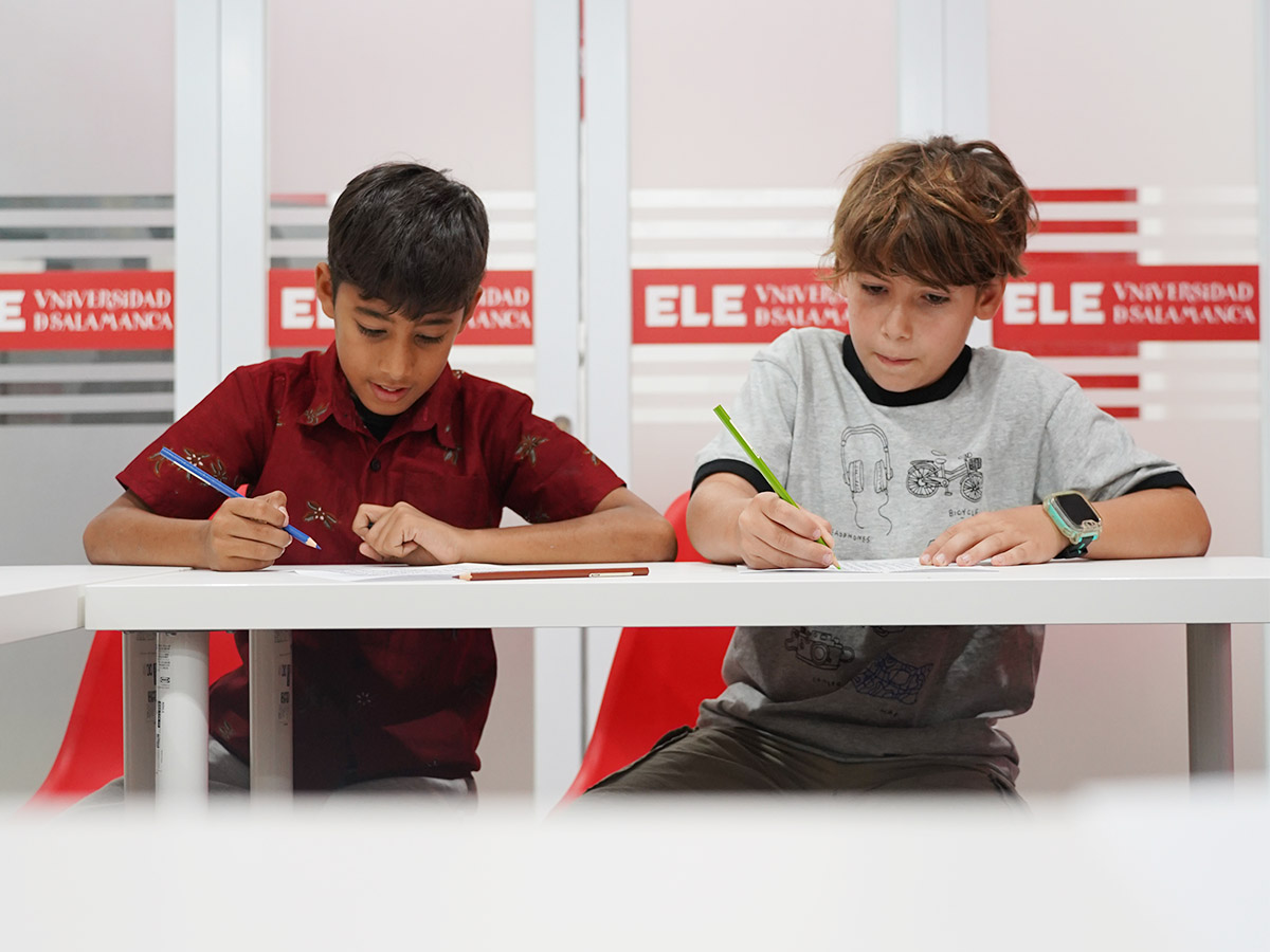 Children using Spanish during a creative classroom activity