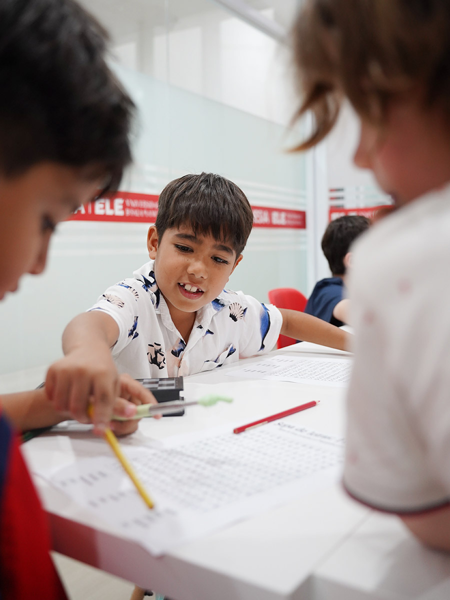 Teenagers learning Spanish together in a modern classroom
